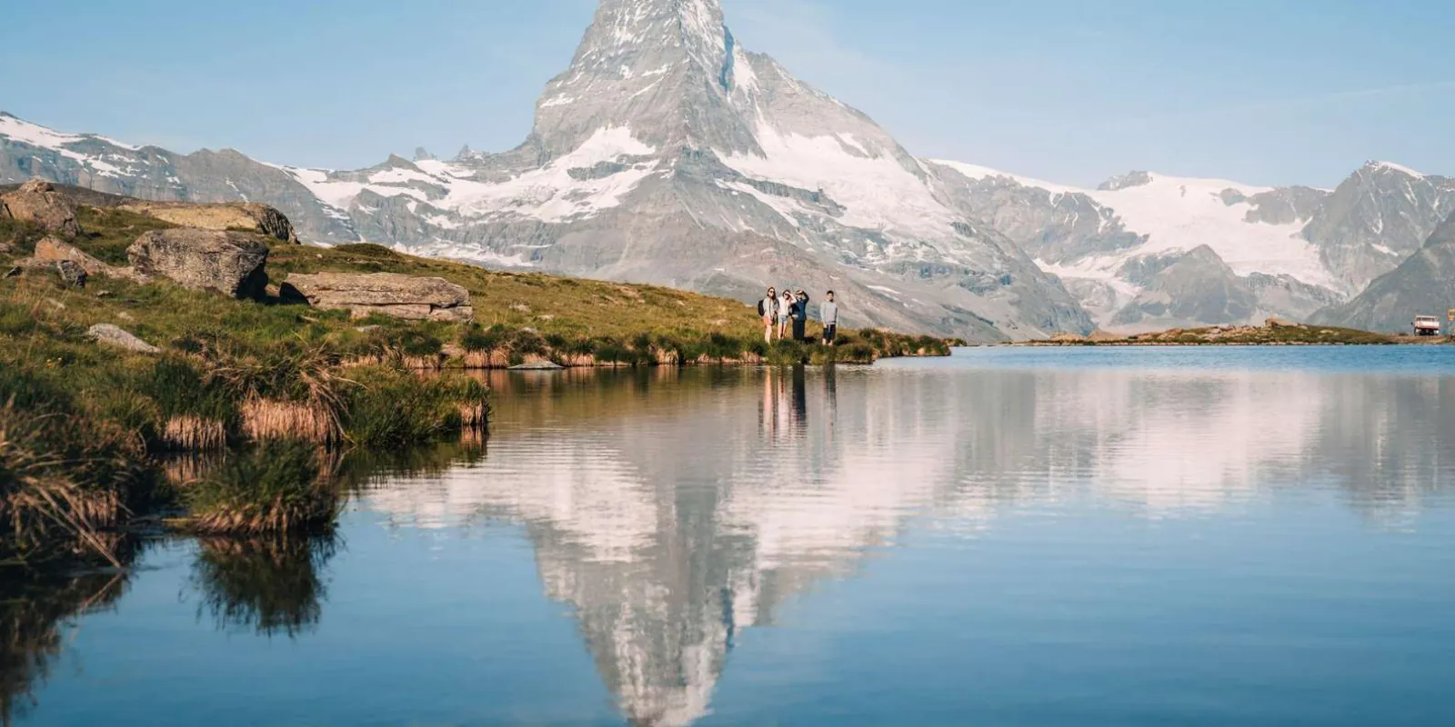 An alpine lake above Zermatt holding a mirror reflection of the Matterhorn