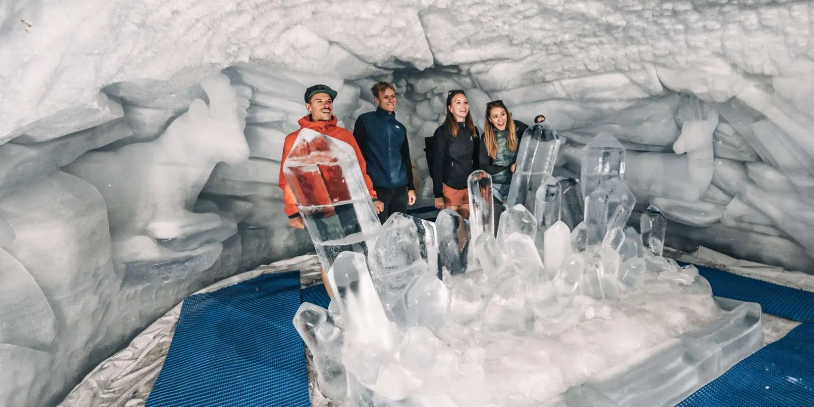 Ice sculptures lit inside the Glacier Palace, the ice cave carved beneath the Theodul Glacier
