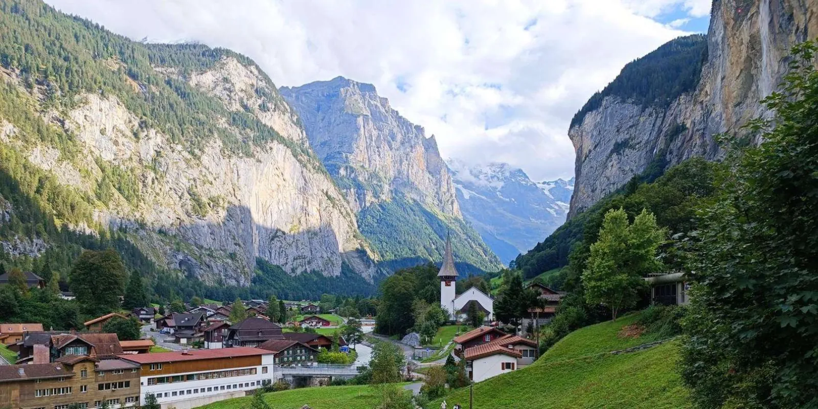 The Lauterbrunnen valley, its church and chalets framed by sheer cliffs and snow peaks
