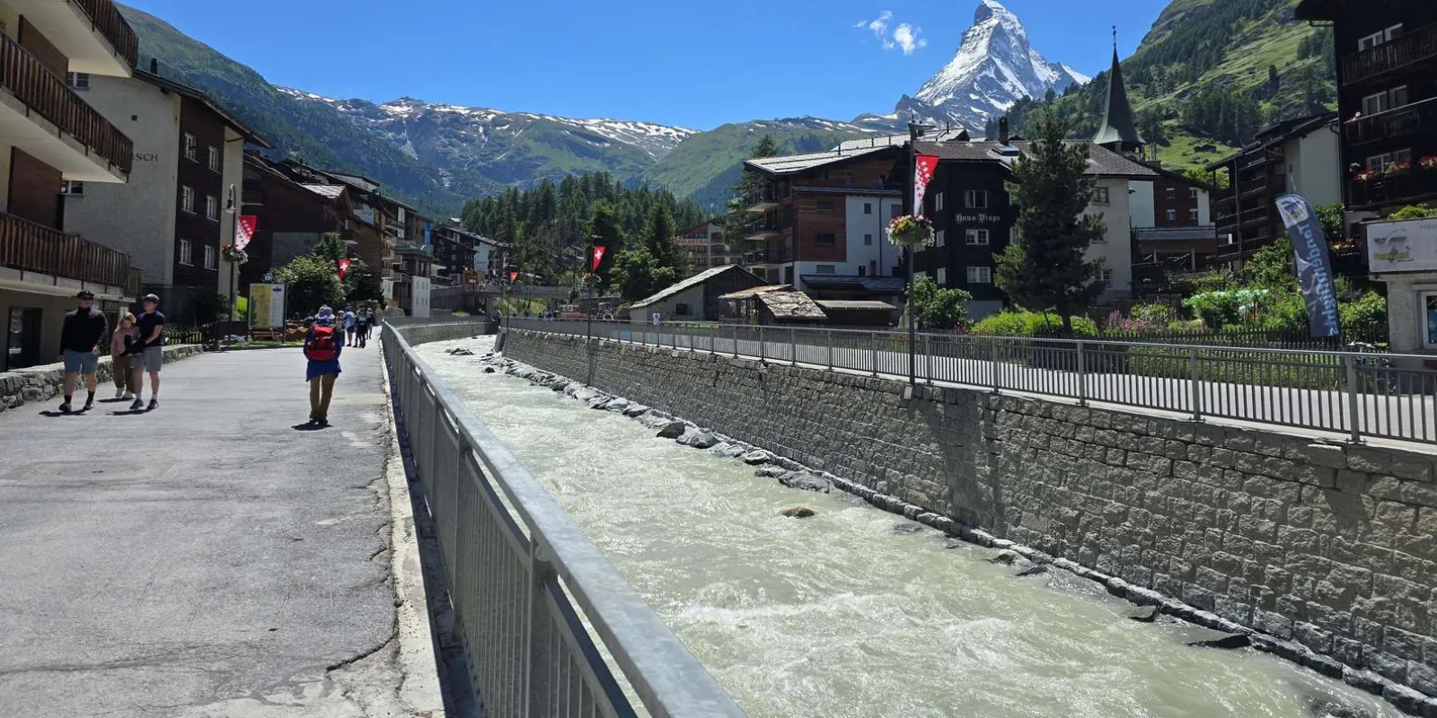 The riverside promenade along the Matter Vispa in Zermatt with the Matterhorn beyond