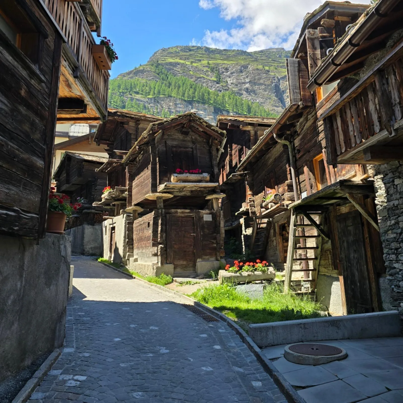 A cobbled lane running through Zermatt's oldest quarter of timber buildings