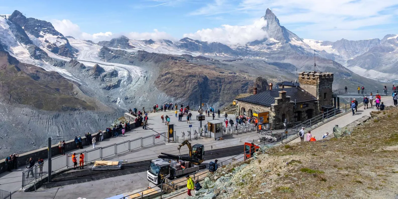 Visitors on the Gornergrat summit terrace above the Gorner Glacier with the Matterhorn behind