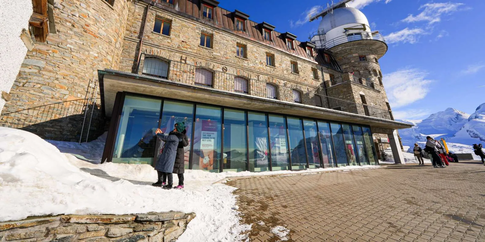The stone Kulmhotel and its observatory dome on the Gornergrat summit